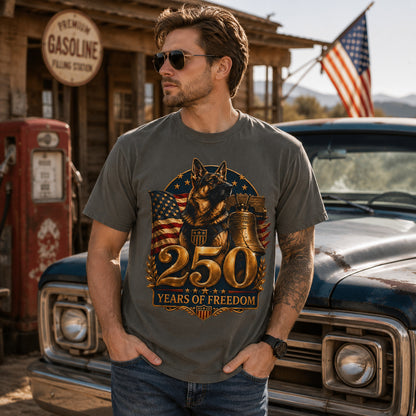 Model wearing a pepper 250 Years of Freedom K9 Tribute t-shirt with a German Shepherd in a patriotic scene