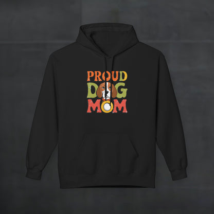 Black hoodie mockup featuring colorful “Proud Dog Mom” text design, cozy dog lover pullover hoodie with vibrant retro typography on a dark background.