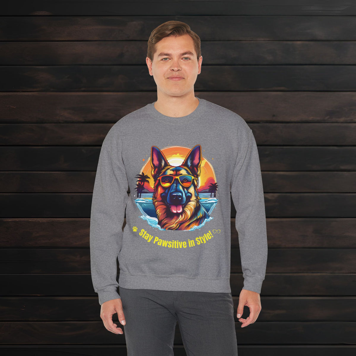 Man posing in a graphite heather unisex heavy blend crewneck sweatshirt with bold German Shepherd illustration and casual comfort fit.