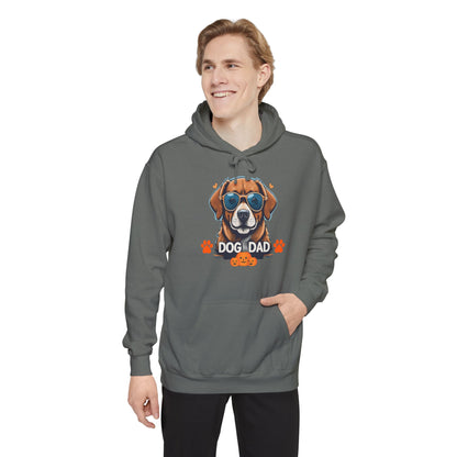 Man wearing a grey unisex “Dog Dad” hoodie with colorful sunglasses dog graphic, trendy cozy pet lover hoodie with modern casual look.