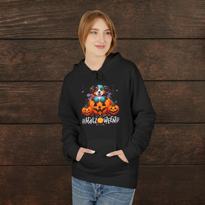 Woman wearing a black Halloween hoodie featuring a cute spooky puppy inside a jack-o’-lantern with glowing pumpkins and “Halloween” text, cozy fall dog lover apparel mockup on rustic wooden background.
