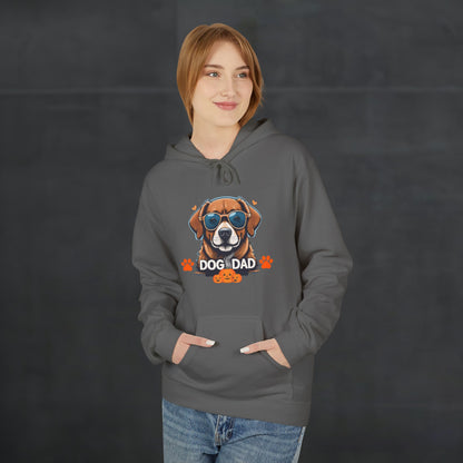 Woman wearing a charcoal gray “Dog Dad” hoodie featuring colorful dog face artwork, comfortable dog lover hoodie with trendy casual style.