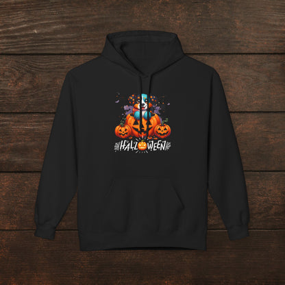 Black Halloween hoodie featuring spooky pumpkin artwork with a ghost character, glowing jack-o’-lanterns, and “Halloween” typography, cozy unisex hoodie mockup on dark wooden background for festive fall apparel listing.