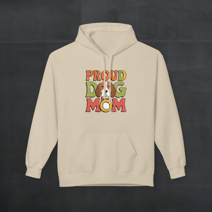 Sand-colored hoodie mockup featuring colorful “Proud Dog Mom” text design, warm and cozy dog mom hoodie with vibrant retro lettering. On dark background 