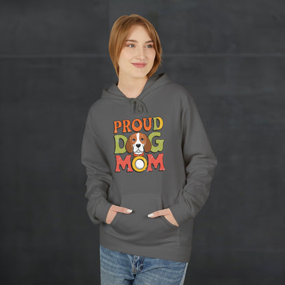 Woman wearing a charcoal black “Proud Dog Mom” hoodie with colorful retro lettering, cozy dog lover hoodie mockup with modern casual style.