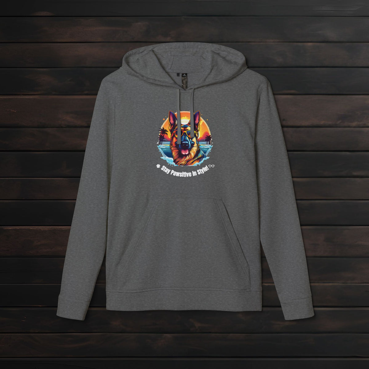 Dark Grey Heather adidas® unisex fleece hoodie mockup with vibrant dog graphic and motivational pet lover design displayed against a rustic wood background.