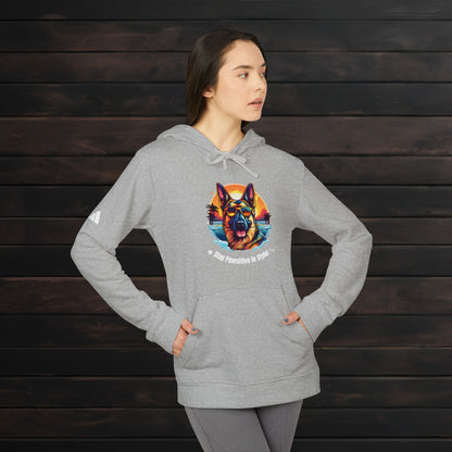 Woman wearing a Grey Heather adidas® unisex fleece hoodie featuring vibrant dog artwork and stylish pet lover graphic design.