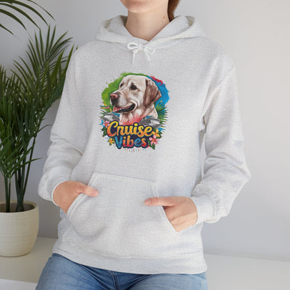 Woman modeling an ash unisex heavy blend hooded sweatshirt with vibrant Labrador design and retro-inspired “Cruise Vibes” text.