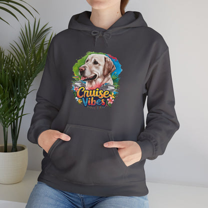 Woman modeling a dark heather unisex heavy blend hooded sweatshirt with vibrant Labrador “Cruise Vibes” graphic and stylish dog lover artwork.
