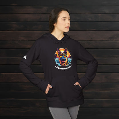 Woman modeling a black adidas® unisex fleece hoodie with colorful dog lover graphic and motivational quote in a cozy casual style.
