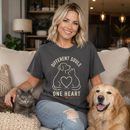 Model wearing a graphite Different Souls One Heart t-shirt with a dog and cat in a lifestyle scene