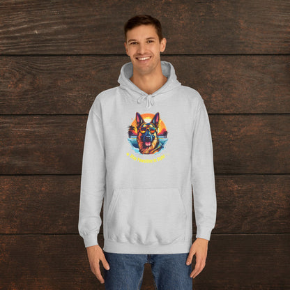 Man wearing a heather grey unisex college hoodie featuring colorful dog artwork and retro-inspired pet lover design.