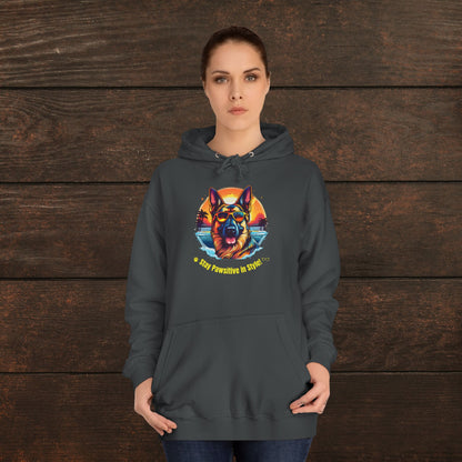 Woman modeling a charcoal unisex college hoodie with vibrant colorful dog graphic and “Stay Pawsitive in Style” motivational text.