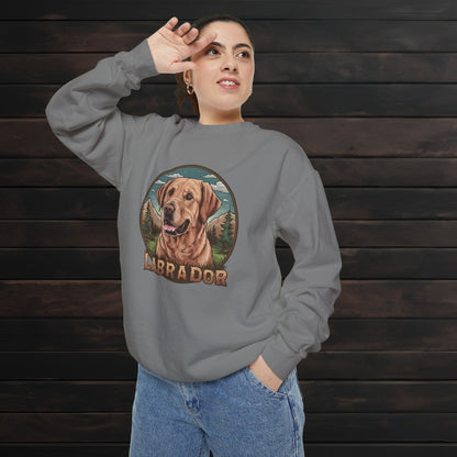 Woman modeling a grey unisex garment-dyed crewneck sweatshirt with Labrador dog illustration and relaxed vintage-inspired style.