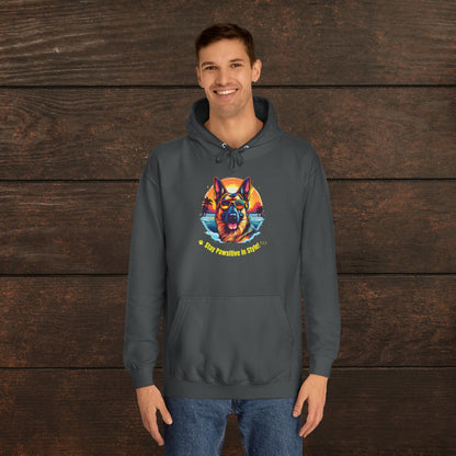 Man wearing a charcoal unisex college hoodie featuring colorful dog artwork and stylish retro-inspired pet lover design.