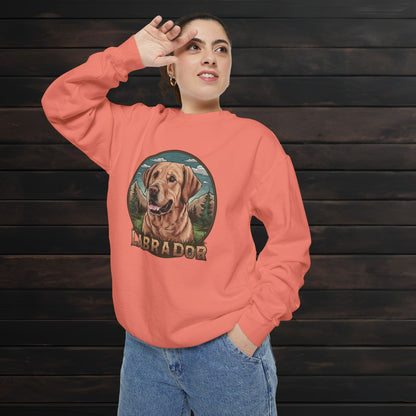 Woman modeling a terracotta unisex garment-dyed crewneck sweatshirt with colorful Labrador dog graphic and cozy casual style.