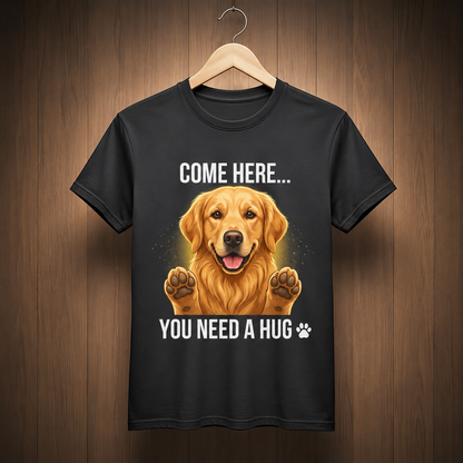 Black Come Here You Need a Hug t-shirt hanging on a wooden hanger against rustic wood