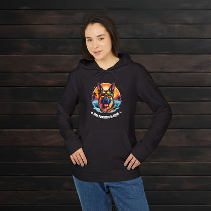 Woman wearing a black adidas® unisex fleece hoodie featuring a vibrant colorful dog graphic with “Stay Pawsitive in Style with PET PRINT LAB!” text against a dark wood background.