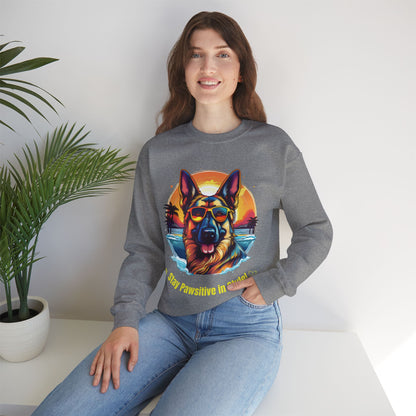 Woman wearing a graphite heather unisex heavy blend crewneck sweatshirt featuring colorful German Shepherd dog artwork and relaxed styling.