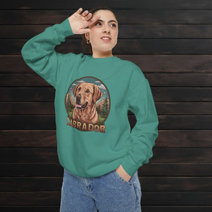 Woman wearing a light green unisex garment-dyed crewneck sweatshirt with colorful Labrador dog artwork and relaxed cozy fit.