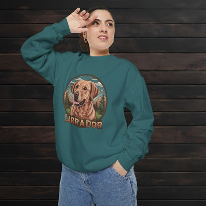 Woman modeling a blue spruce unisex garment-dyed crewneck sweatshirt with Labrador dog illustration and cozy relaxed fit.