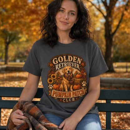 Model wearing a graphite Golden Retriever Pumpkin Patch t-shirt with a Golden Retriever at a pumpkin patch