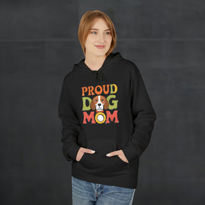 Woman wearing a black “Proud Dog Mom” hoodie with colorful retro text design, cozy casual dog lover apparel for autumn and winter fashion.