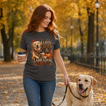 Model wearing a graphite Leaves Lattes & Labrador Love t-shirt with a Labrador in an autumn scene