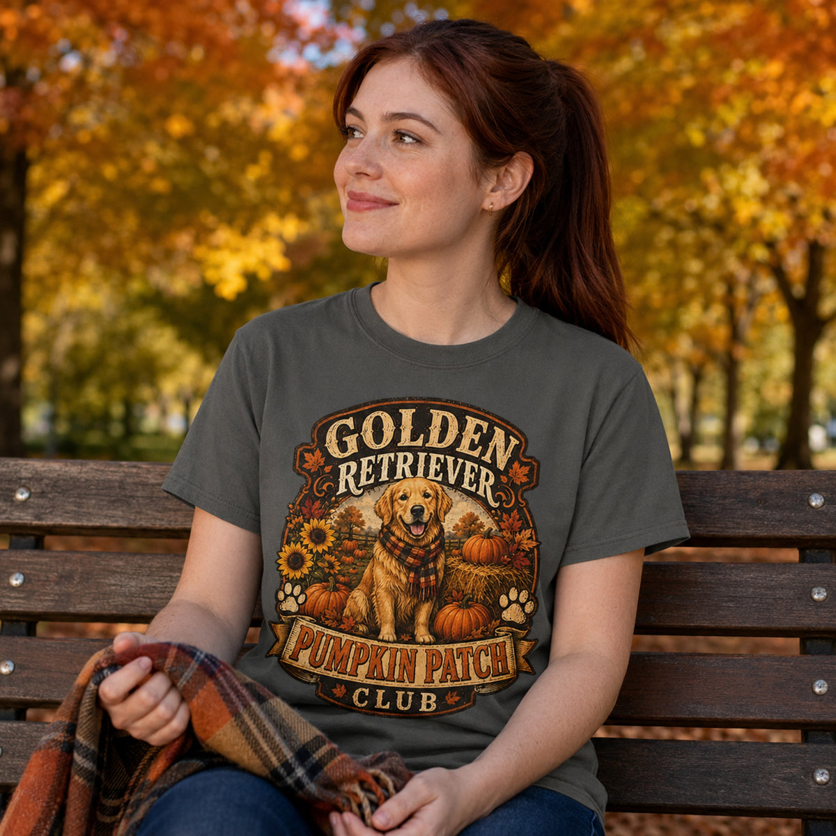 Model wearing a pepper Golden Retriever Pumpkin Patch t-shirt with a Golden Retriever at a pumpkin patch