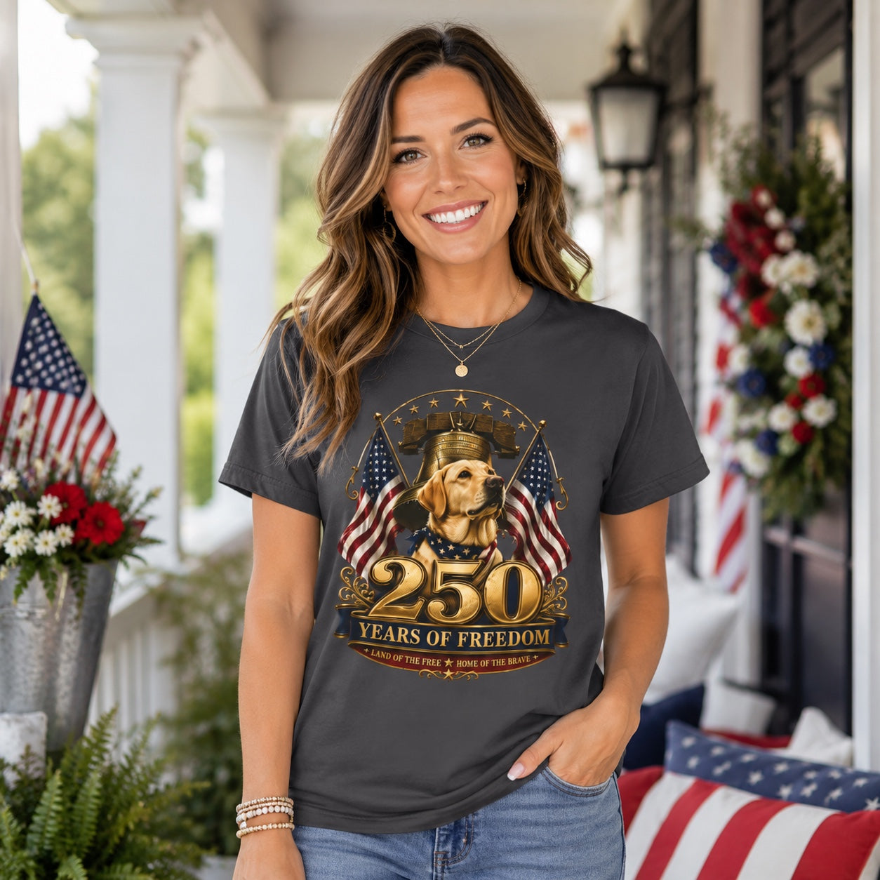Woman wearing a graphite 250 Years of Freedom golden Labrador t-shirt on a porch