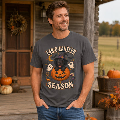 Model wearing a graphite Lab-O-Lantern Season t-shirt with a Black Labrador and pumpkin in a Halloween scene