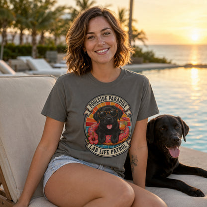 Model wearing a pepper Poolside Paradise t-shirt with a Black Labrador puppy on a pool float