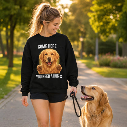 Woman wearing a black Golden Retriever sweatshirt while walking with a cute Golden Retriever dog in the park.