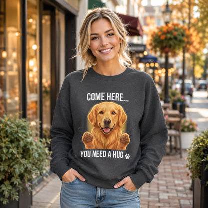 Woman wearing a dark heather Golden Retriever dog lover sweatshirt with “You Need a Hug” text outside a stylish storefront.
