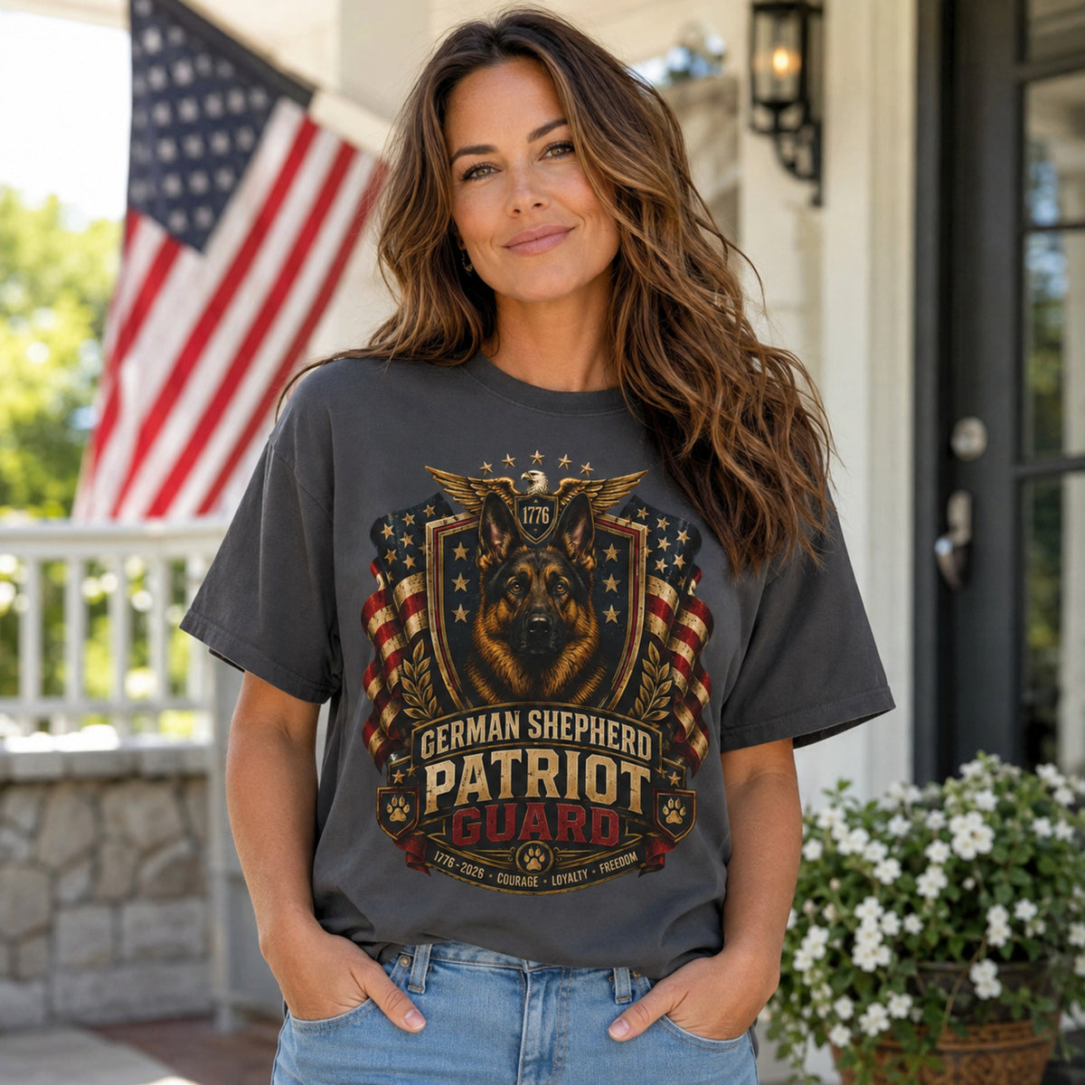 Woman wearing a graphite German Shepherd Patriot Guard T-shirt with a German Shepherd patriotic crest design in a porch lifestyle scene.