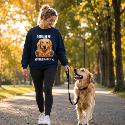 Woman wearing a navy Golden Retriever sweatshirt while walking with a real Golden Retriever dog in the park.