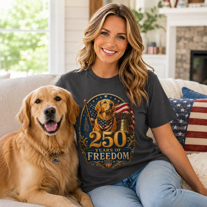 Woman sitting with her golden retriever on a porch, wearing graphite '250 Years of Freedom' t-shirt