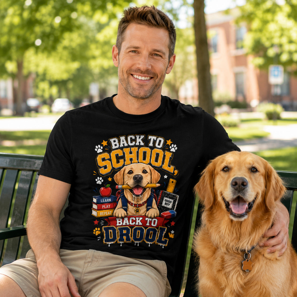 Man sitting on a bench with his golden retriever, wearing black 'Back to School, Back to Drool' dog t-shirt