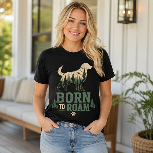 Woman standing on a porch wearing black 'Born to Roam' dog t-shirt