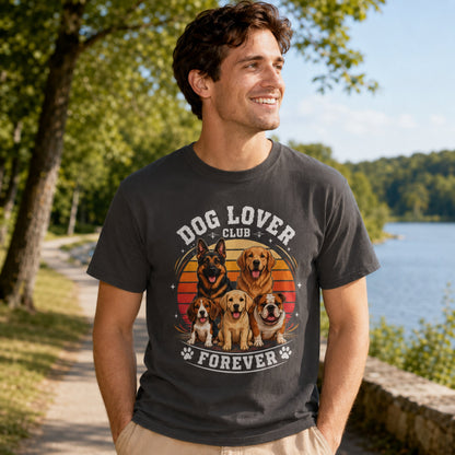 Man wearing a graphite Dog Lover Club Forever T-shirt with multi-breed dog artwork on a lakeside walking path