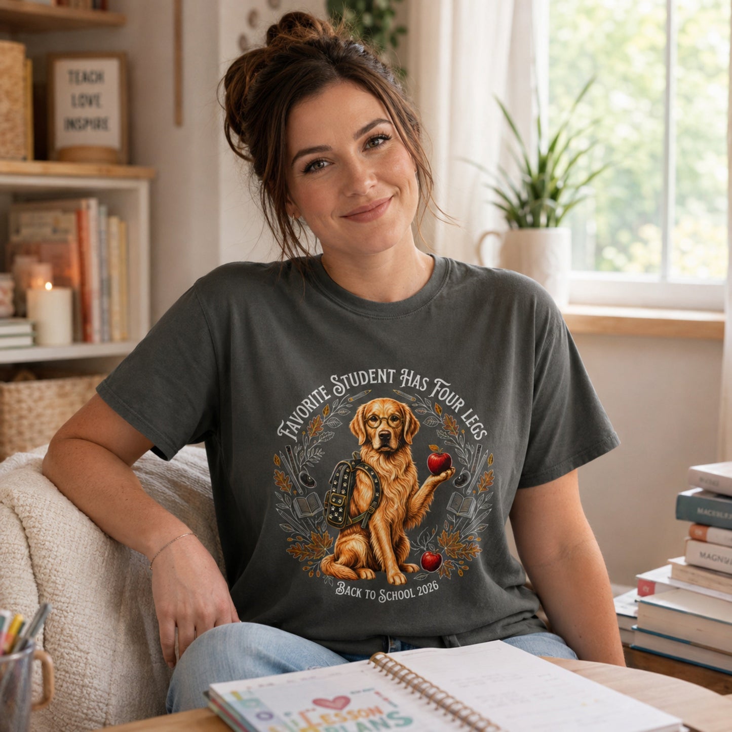 Woman wearing a Pepper Favorite Student Has Four Legs back to school Golden Retriever T-shirt in a casual study room.