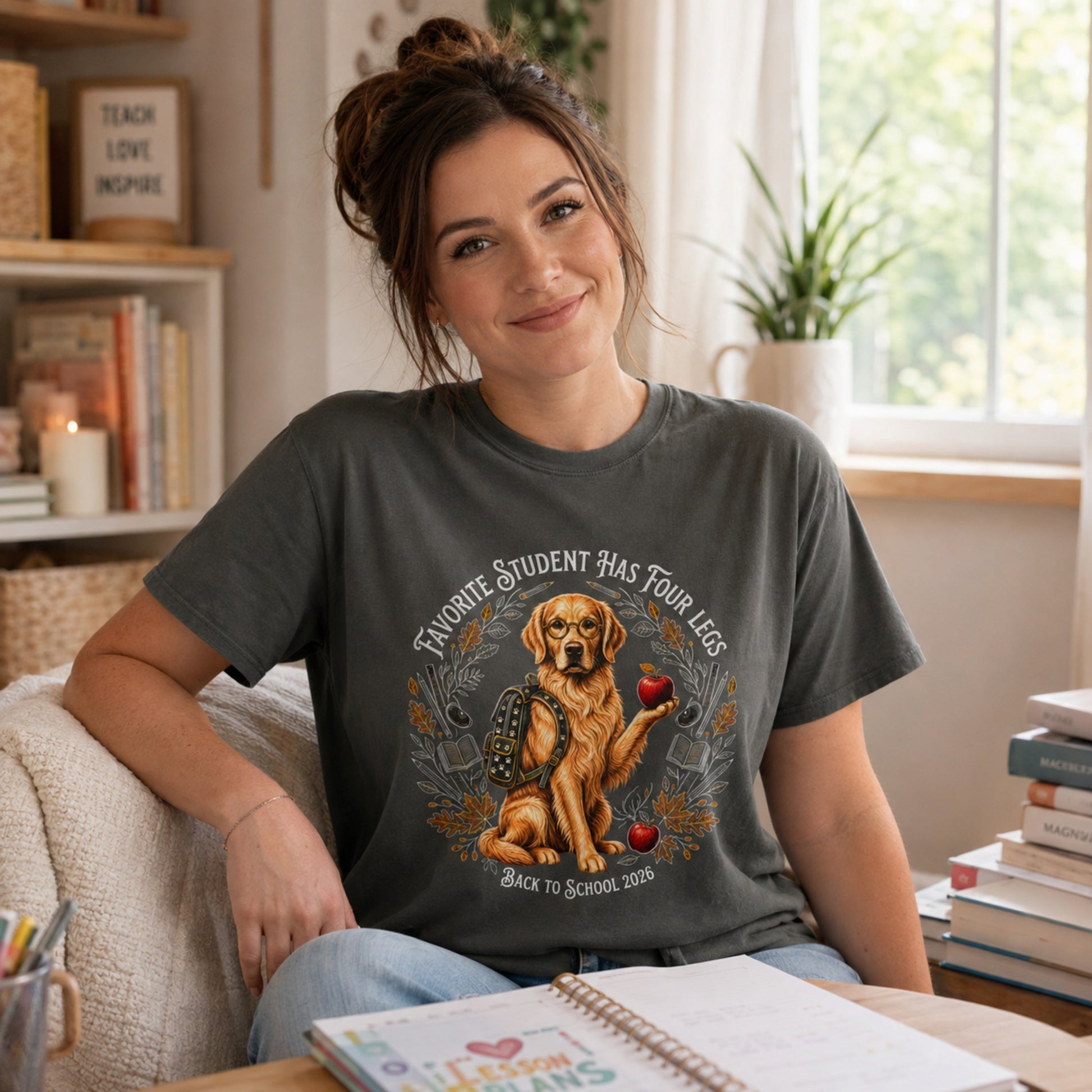 Woman wearing a Pepper Favorite Student Has Four Legs back to school Golden Retriever T-shirt in a casual study room.