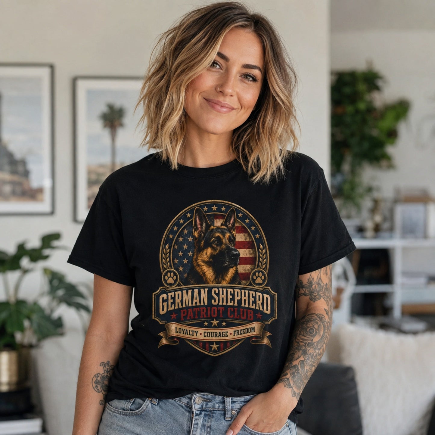 Woman wearing a black German Shepherd Patriot Club T-shirt in a casual indoor home setting.