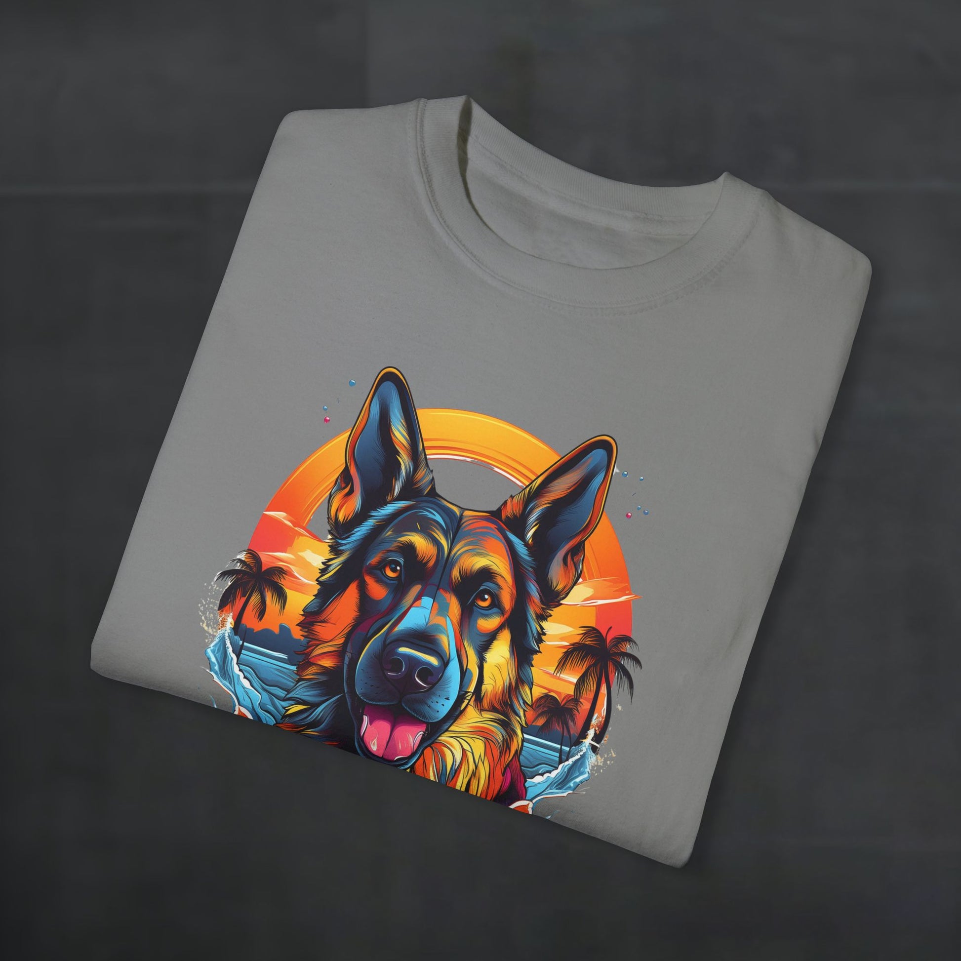 Folded grey 'German Shepherd Tropical Vibes' t-shirt with tropical sunset dog graphic