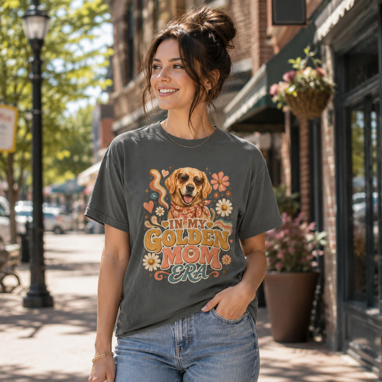 Woman walking down a street, wearing pepper 'In My Golden Mom Era' retro floral t-shirt