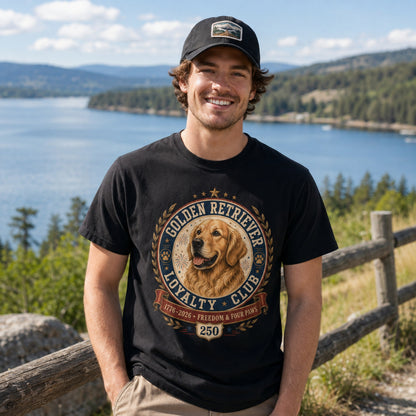 Man wearing a black Golden Retriever Loyalty Club T-shirt at a lakeside outdoor location.