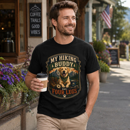 Man in black hiking dog t-shirt holding coffee outside a mountain town coffee shop