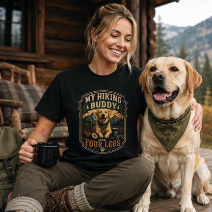 Woman sitting with golden retriever on a cabin porch, wearing black hiking buddy dog t-shirt