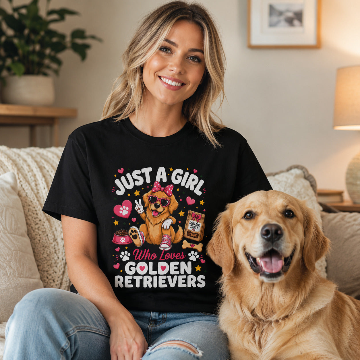 Woman sitting on a couch with her golden retriever, wearing black 'Just A Girl Who Loves Golden Retrievers' t-shirt