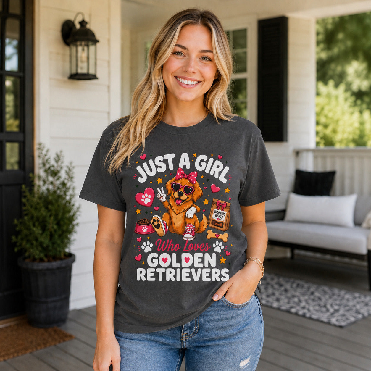 Woman standing on a porch wearing graphite 'Just A Girl Who Loves Golden Retrievers' t-shirt